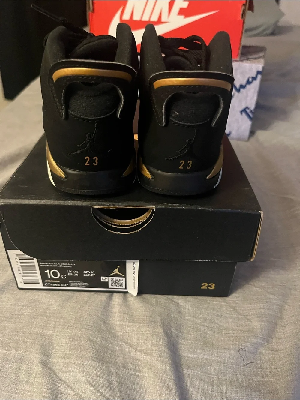 Jordan Kids Black High-Top Sneakers with Gold Accent